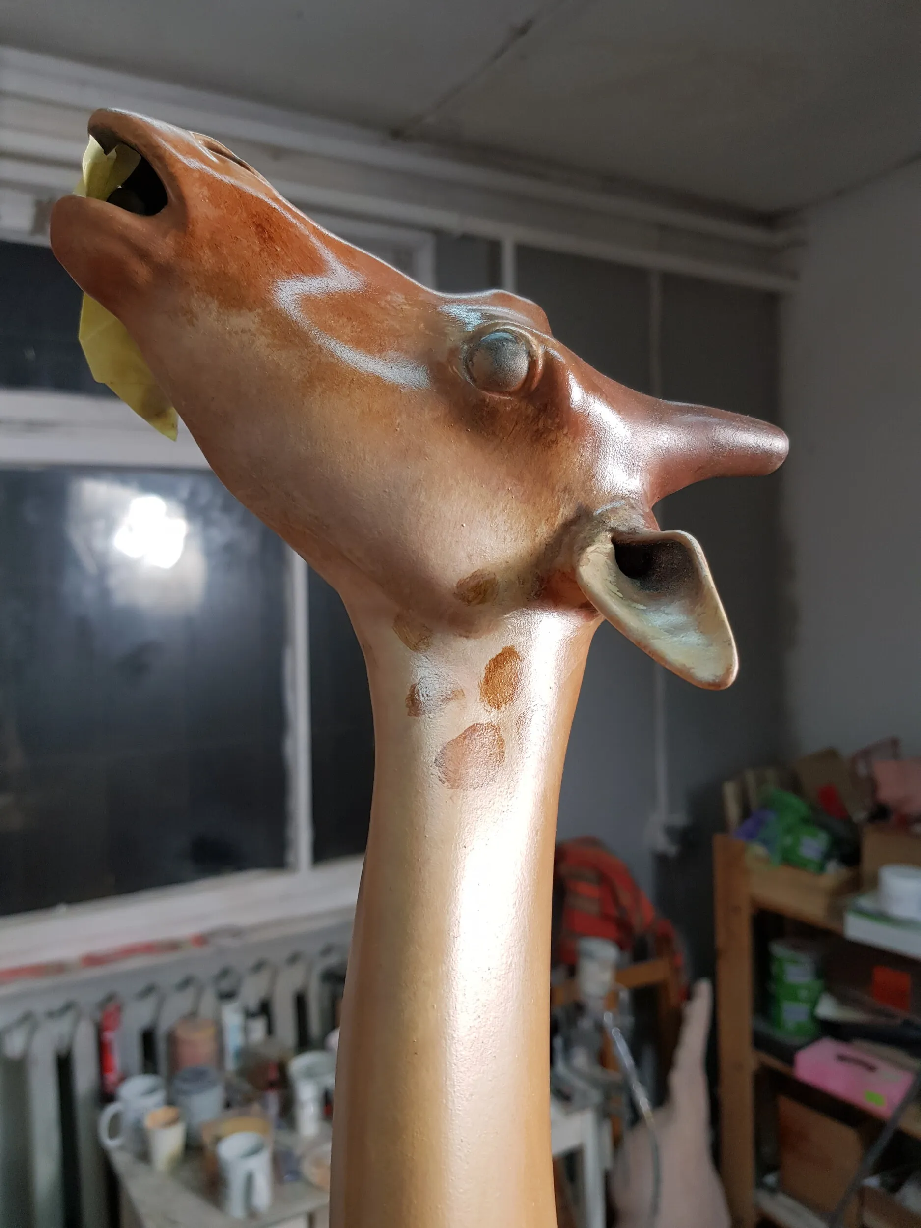 Artistic painting of the skating giraffe figure.
